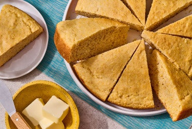 Cornbread sliced and arranged on a plate
