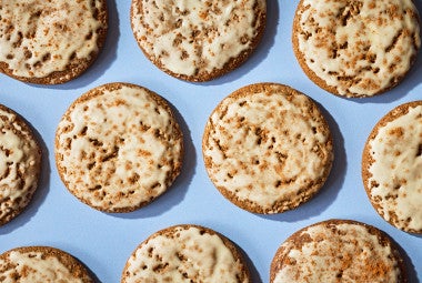 Gingerbread Latte Cookies arranged on a blue surface