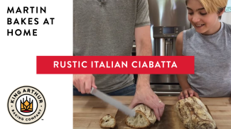 Martin and Arlo slicing ciabatta