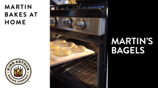 Tray of bagels going into the oven