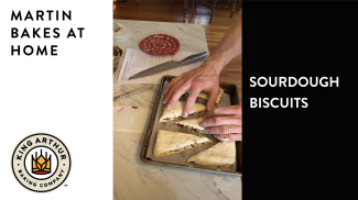 Preparing unbaked biscuits on baking sheet